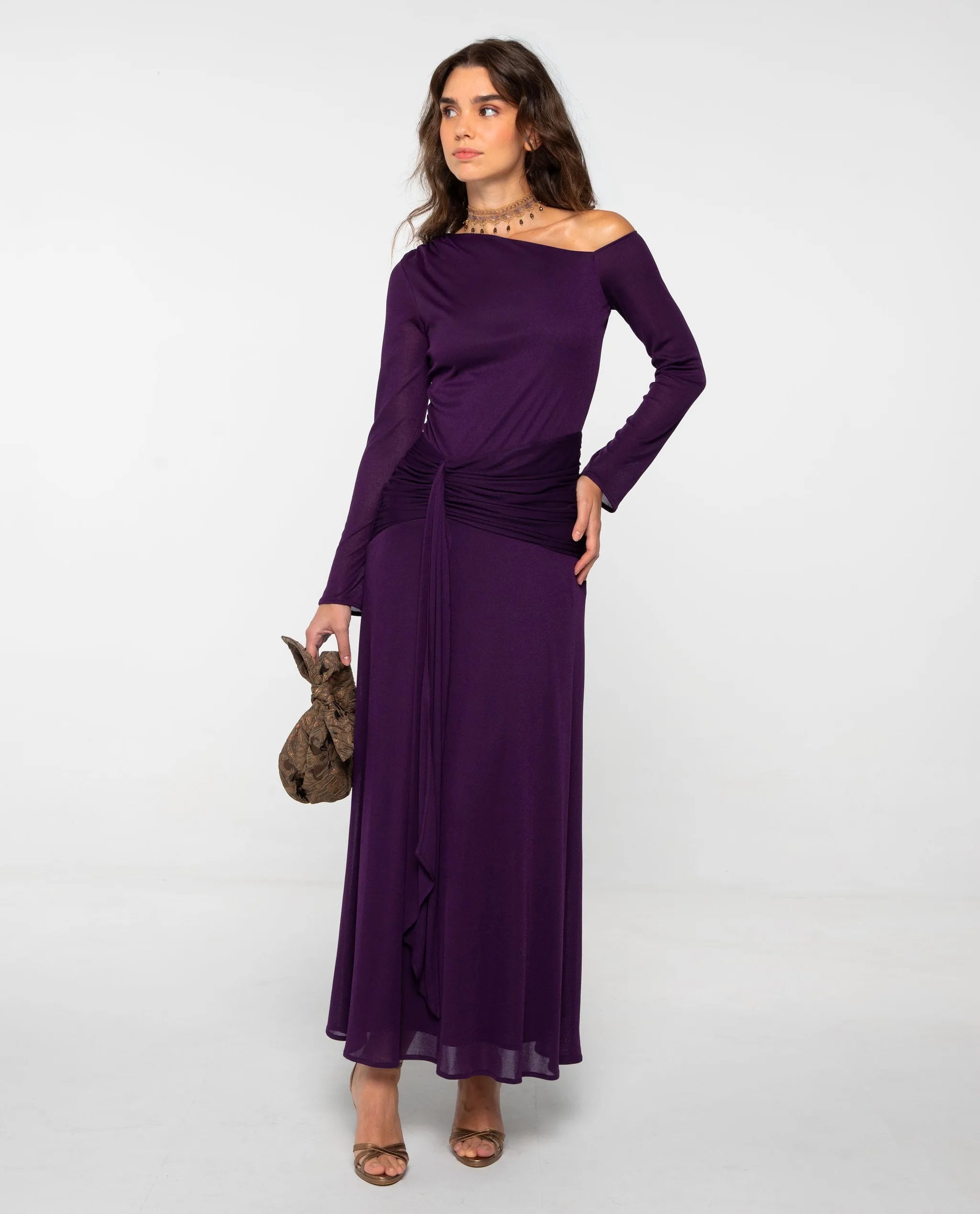 Long knit dress with purple sash and asymmetrical neckline